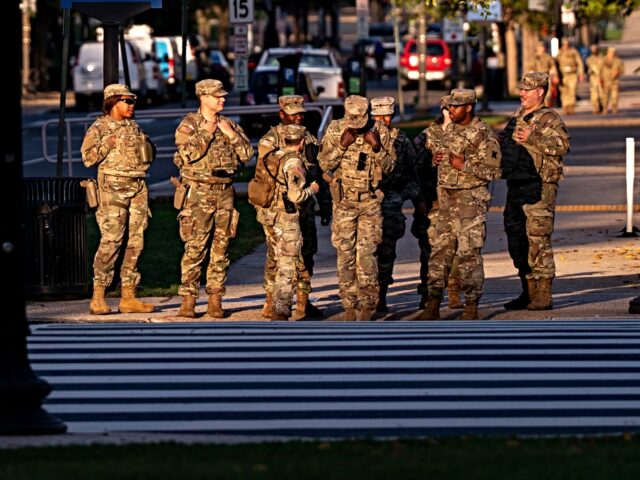 WASHINGTON, DC - OCTOBER 1: Members of the National Guard patrol near the U.S. Capitol on