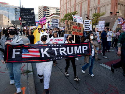 Demonstrators protest the Trump administration during the "No Kings" national rally in Den