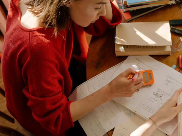 pexels-cottonbro-4778660 Girl in Red Long Sleeve Shirt Writing on White Paper