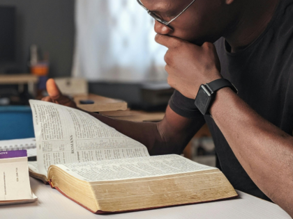 Man Reading a Bible