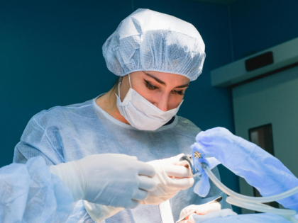 Woman Surgeon Performing an Operation
