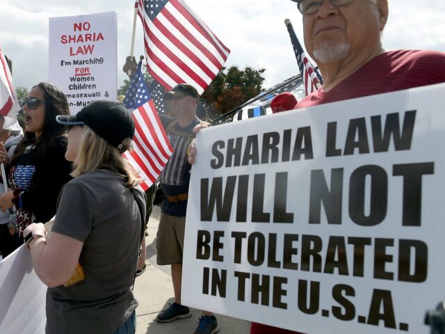 sharia law SAN BERNARDINO, CA - JUNE 10: "March Against Sharia Law" protesters and counter protesters