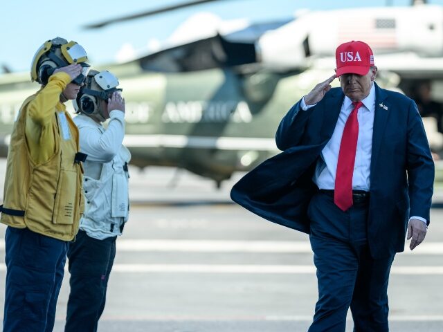 President Donald Trump and First Lady Melania Trump greet commanding officers aboard the a