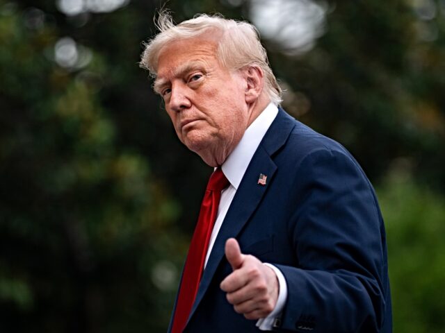 US President Donald Trump walks on the South Lawn of the White House after arriving on Mar