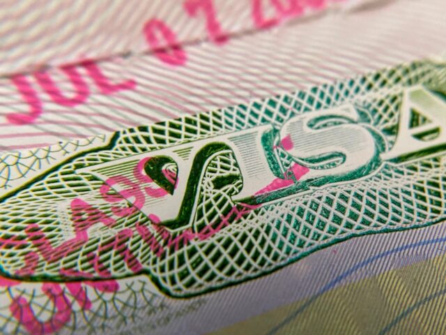 us visa holder This photo illustration shows a visa stamp on a foreign passport in Los Angeles on June 6,