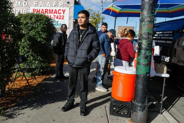 Eduardo Santoyo stands by his family's tamales stand in the Little Village neighborho