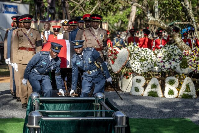 Military officers saluted as Odinga's coffin was lowered into the ground and trumpets