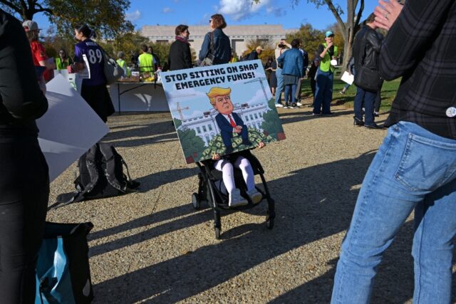 People attend the People's Pantry Food drive to replenish food banks ahead of SNAP la