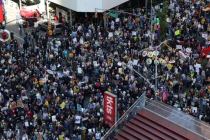 People flood New York's Times Square during a 'No Kings' national day of pr