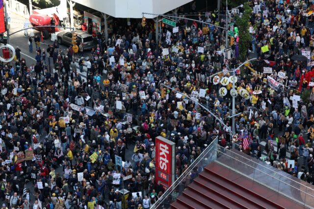 People flood New York's Times Square during a 'No Kings' national day of pr
