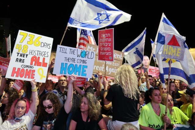 People gather at "Hostages' Square" in Tel Aviv, to celebrate the agreement