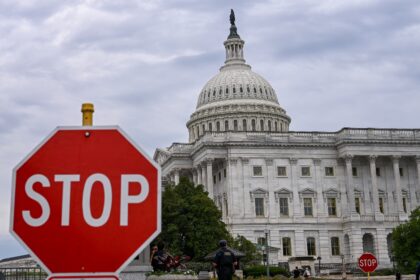 A stop sign is seen in front of the US Capitol -- where talks to repoen the federal govern