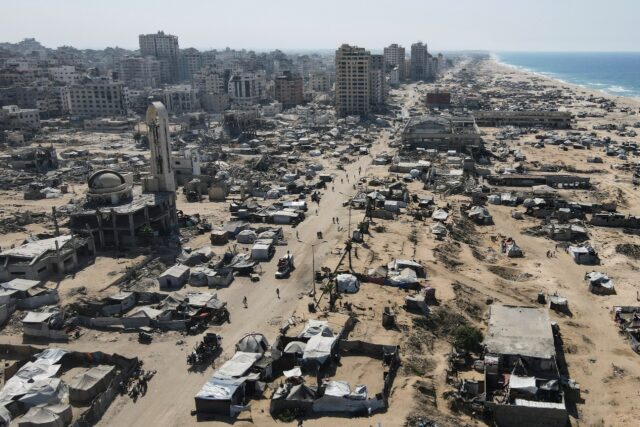 Tents sheltering displaced Palestinians in the war-damaged area surrounding Gaza City'