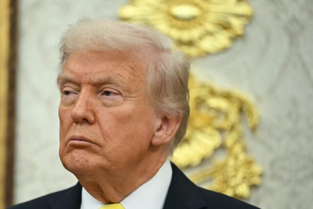 US President Donald Trump looks on during a press conference in the Oval Office of the Whi
