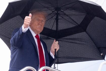 US President Donald Trump gives a thumbs up while boarding Air Force One bound for Israel,