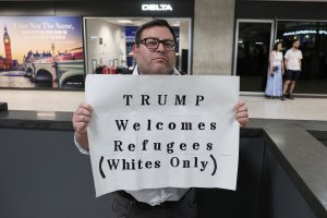 Trump sets record-low refugee cap; most slots for White S. Africans