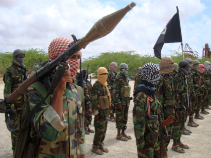 FILE - Al-Shabaab fighters display weapons as they conduct military exercises in northern
