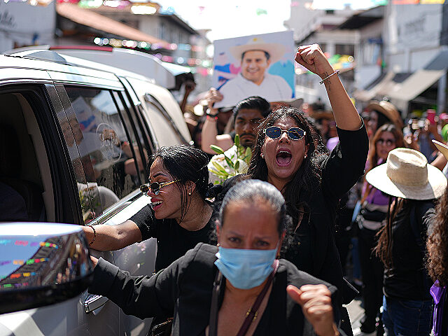AP25306740006053 (1) People chant during a funeral procession for late Mayor Carlos Alberto Manzo Rodríguez,
