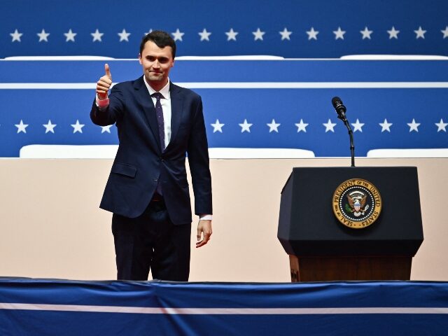 Charlie Kirk gives students a thumbs up