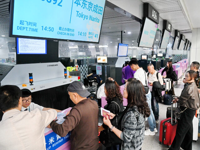Passengers check in for Fujian's first flight granted the Fifth Freedom of the Air to