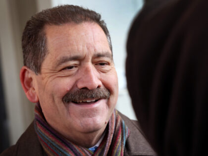 Chicago mayoral candidate Congressman Jesus "Chuy" Garcia greets commuters at an