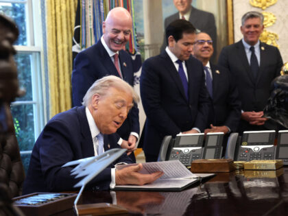 U.S. President Donald Trump, joined by FIFA President Gianni Infantino (2L), delivers rema