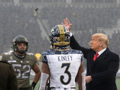 President Donald J. Trump tosses a coin in the air Saturday, Dec. 12, 2020, prior to the s
