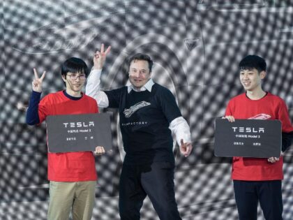 Elon Musk hams it up at Tesla China