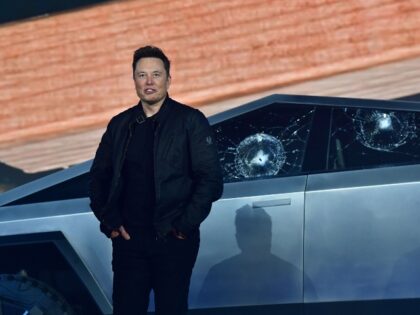 Elon Musk near his smashed Cybertruck