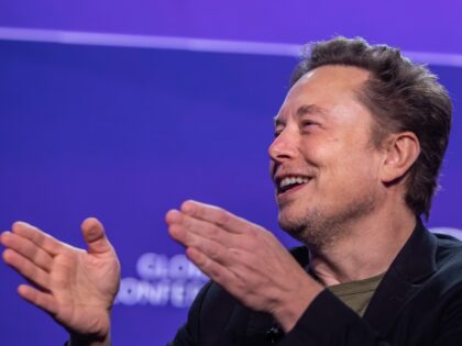 Elon Musk witha pose and a smile