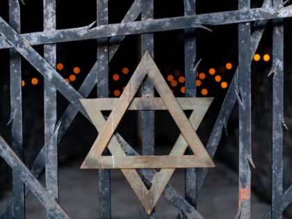 29 April 2020, Bavaria, Dachau: A Star of David and candles can be seen at the Jewish memo