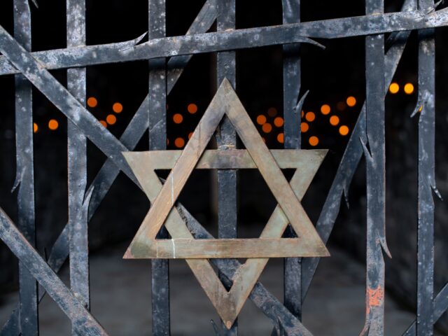 29 April 2020, Bavaria, Dachau: A Star of David and candles can be seen at the Jewish memo