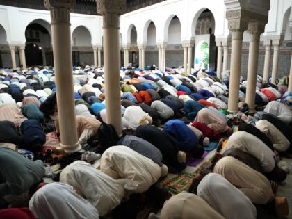 Muslim worshippers attend the morning Eid al-Adha prayers at the Grande Mosquee or the Gre
