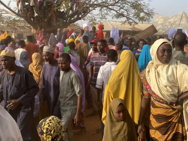 TOPSHOT - Children, who were released after being kidnapped by gunmen in Kuriga, are reuni