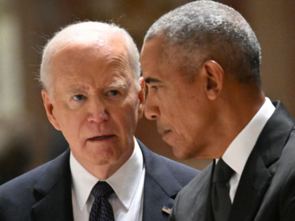 US President Joe Biden (L) and former US President Barack Obama attend a memorial service