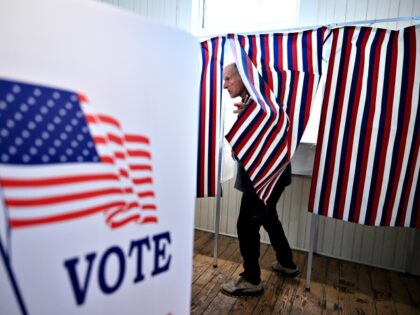 SANBORNTON, NH - JANUARY 23: A voter prepares to leave a voting booth as they take part in