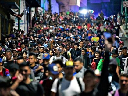 Migrants from a caravan in Tapachula, Chiapas state, Mexico, march while heading to the US