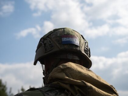 GARDELEGEN, GERMANY - APRIL 9: A Dutch soldier wears a Netherlands flag patch on his helme