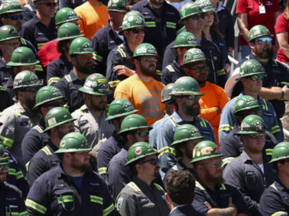 HUGER, SOUTH CAROLINA - MAY 1: Steel workers listen as U.S. Vice President JD Vance speaks