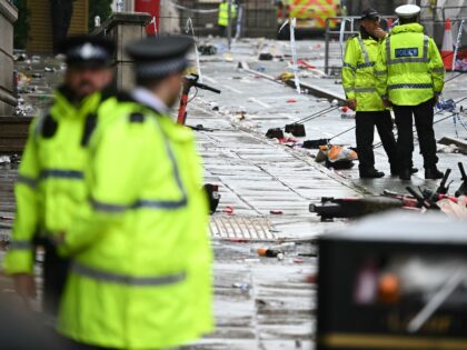 Police officers work at the scene on Water Street in Liverpool, north-west England on May