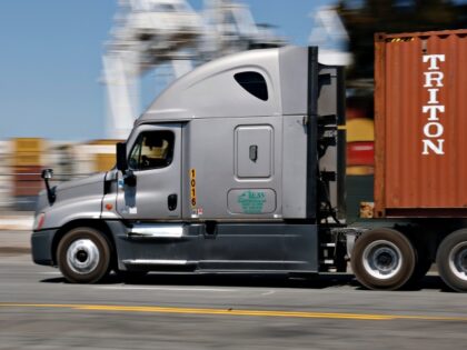 OAKLAND, CALIFORNIA - AUGUST 26: A truck drives through the Port of Oakland on August 26,