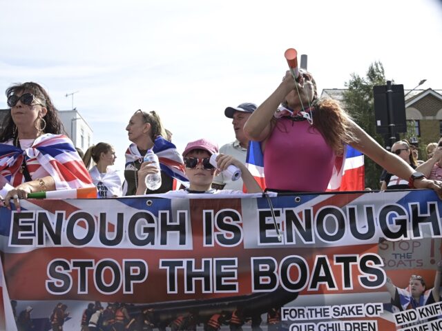 FAVERSHAM, KENT, UNITED KINGDOM - SEPTEMBER 06: Protesters carrying flags and banners marc