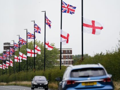 The flag of the United Kingdom and the Flag of St George hang from lamposts in Birmingham.