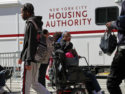 NEW YORK, NEW YORK - OCTOBER 01: People gather outside of their apartments after a gas exp