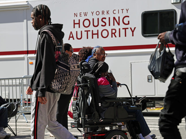 GettyImages-2238599502 NEW YORK, NEW YORK - OCTOBER 01: People gather outside of their apartments after a gas exp