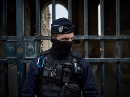 PARIS, FRANCE - OCTOBER 19: French Police officers seal off the entrance to the Louvre Mus
