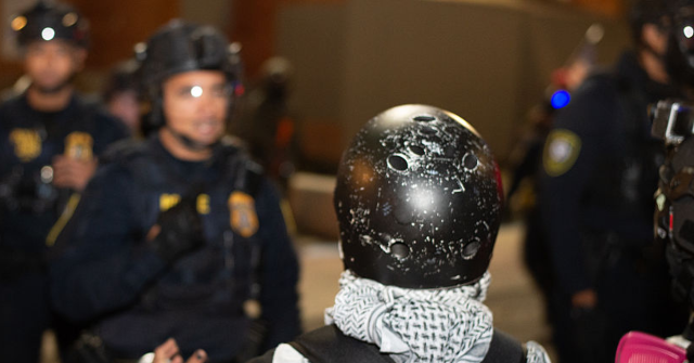 
                            VIDEO: Portland Leftist Accused of Impeding ICE Mewls 'I'm Just a Mom' During Arrest