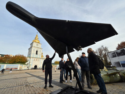People look at an Iranian-designed Shahed 136, (Geranium-2) drone of Russian Army at an op