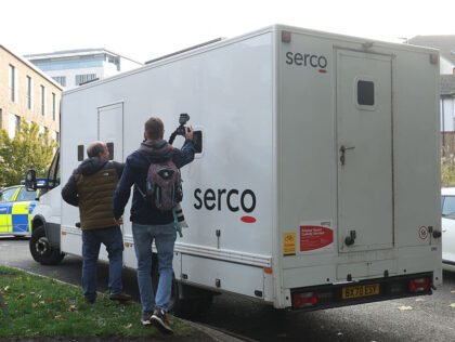 Photographers attempt to capture a picture of the suspected perpetrator of multiple stabbi