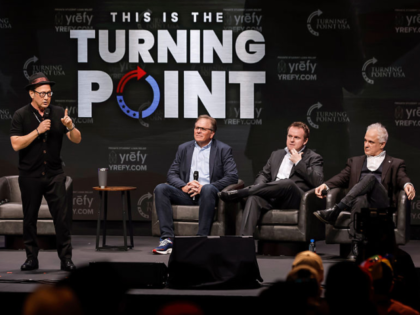 Comedian and actor Rob Schneider responds to a question with panelists Frank Turek, Andrew